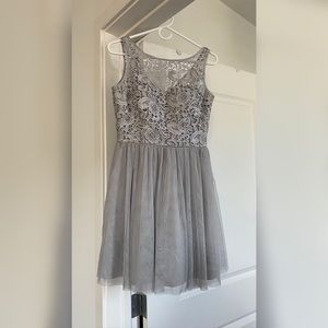 Cute Aidan Mattox cocktail dress. Silver grey and detailed embroidery top half.